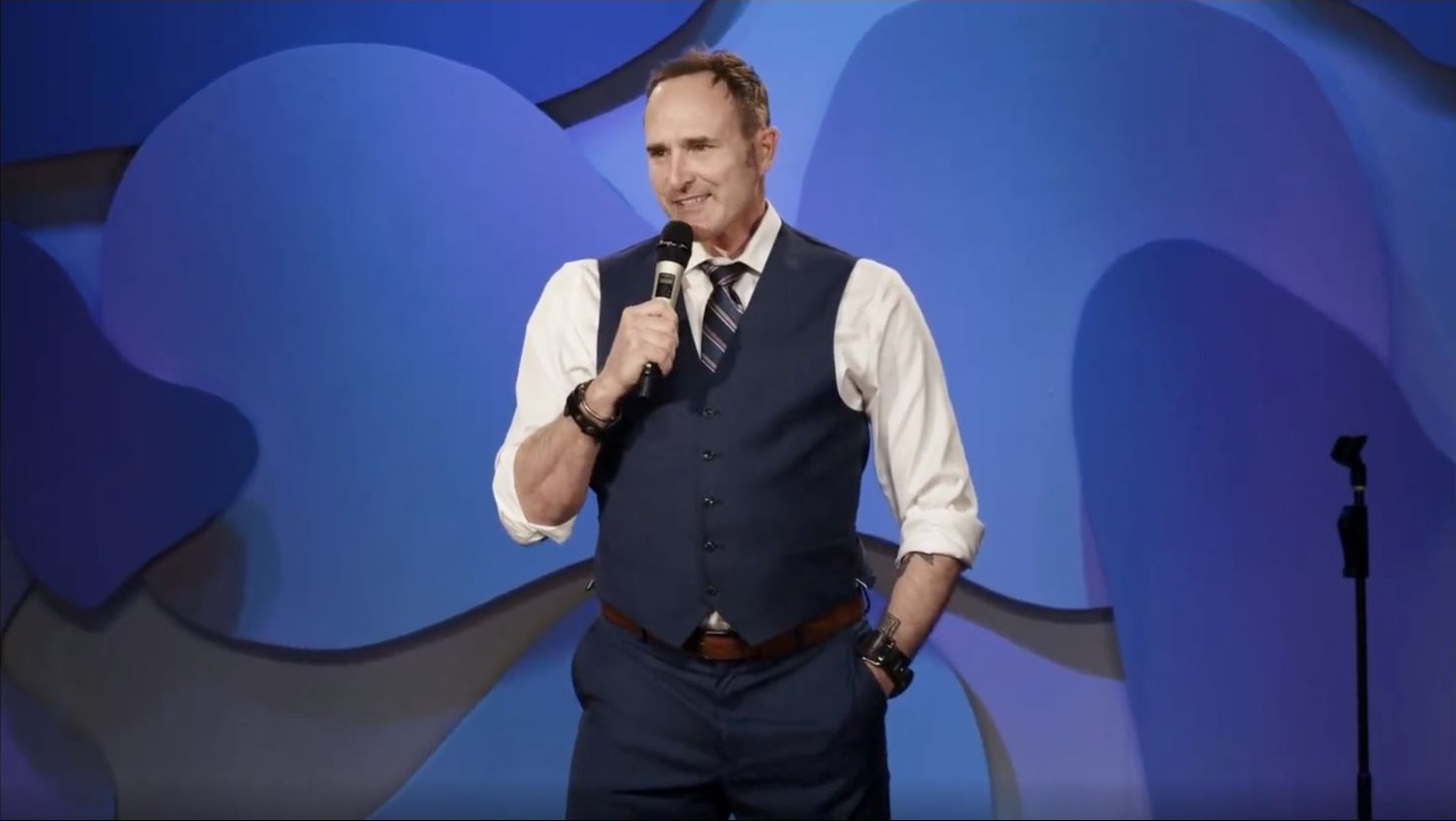 Sean Kent performing stand-up comedy onstage